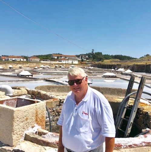 Traditionally salt is made from shallow ponds where seawater is evaporating. The salt is daily scraped up and dried on tables. This picture is from Portugal.